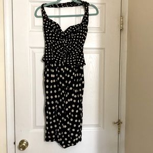 1940’s corset polka dot dress. Hugs body to form hour glass figure